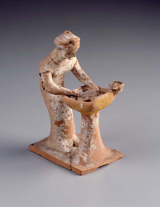 Estatueta de uma mulher amassando massa na calha c.500–475 a.C. 