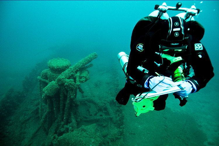 Diver beside wreck