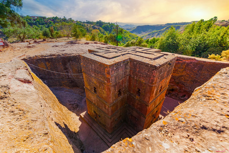 Priest in Bet Danaghel Church holding the Cross of King Lalibela. The  rock-hewn churches of Lalibela make it one of the greatest  Religio-Historical sites not only in Africa but in the Christian